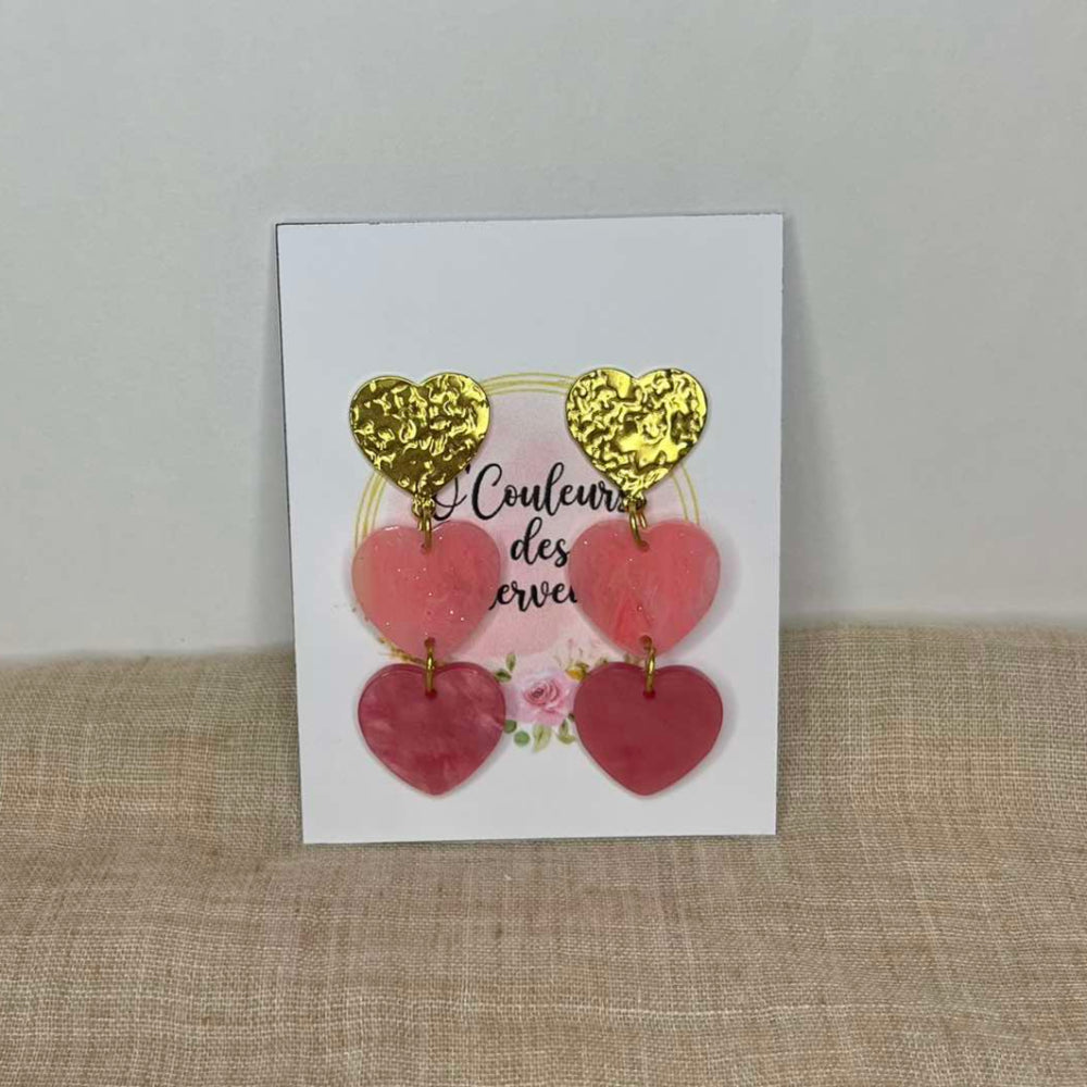 Boucles d'oreilles pendantes cœurs roses