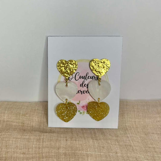 Boucles d'oreilles pendantes cœurs blanc-doré